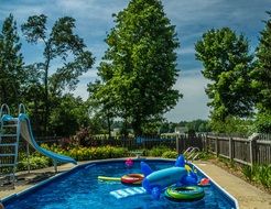 inflatable toys in the pool in the garden