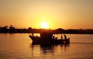 boat in golden backlight in the sea