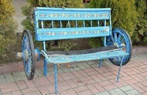 blue wooden bench with wheels