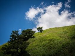 blue sky and clouds over the hill
