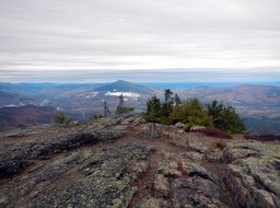 stratus clouds above the top of mountain
