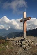 wooden cross on top of a mountain in Austria