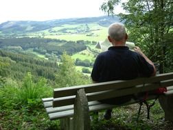 rest on a bench in the mountains