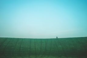 green grass field blue sky view