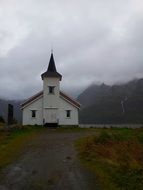 chapel at foggy mountains, norway, lofoten islands