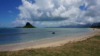 panoramic view of the beach under a cloudy sky