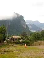 Man in a clearing in a mountain village