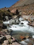 cascade river at the foot of the mountain