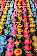 Beautiful and colorful hats on cactctus figures with sombreros in Peru