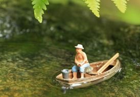 miniature of the angler on the pond among the plants