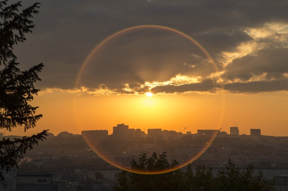 morning sun behind the clouds