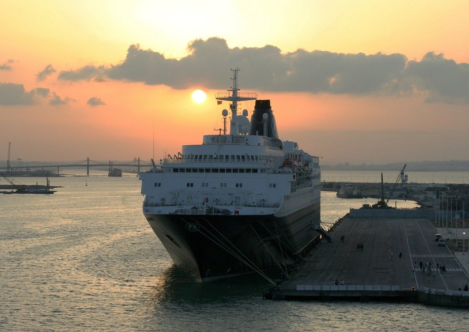 big white liner at sunset
