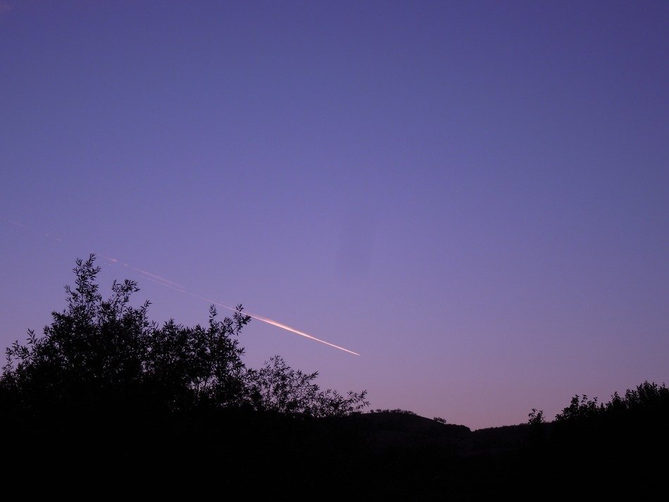 contrail on the purple sky
