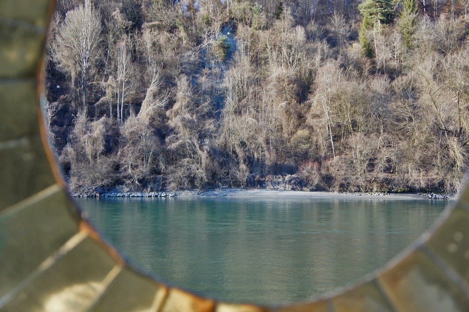 view of the lake through the metal window