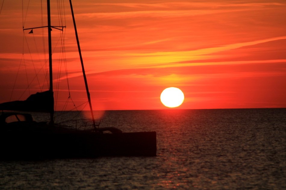 round sun in the sunset over the sea