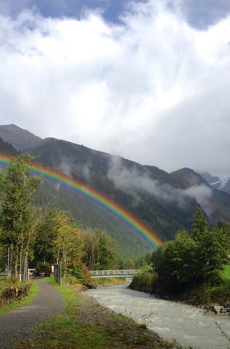 rainbow after rain in mountains