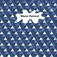 pattern of triangles and snowflakes on a blue background