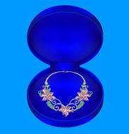 female necklaces with precious stones in a box