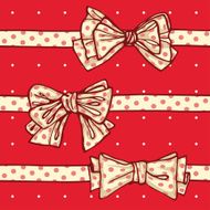 three polka-dotted bows on red background