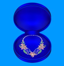 female necklaces with precious stones in a box