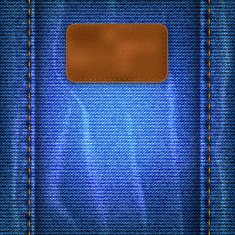 Jeans background with a leather label