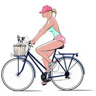 Woman on a bicycle with dog