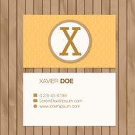Business card with alphabet letter on a wood background N12