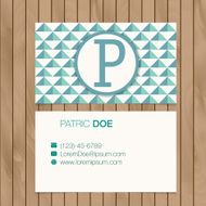 Business card with alphabet letter on a wood background N14