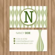 Business card with alphabet letter on a wood background N15