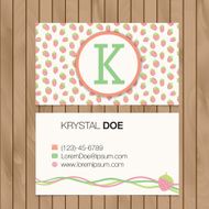 Business card with alphabet letter on a wood background N17
