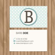 Business card with alphabet letter on a wood background N18