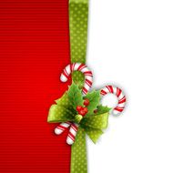 Christmas decoration with holly leaves and candy