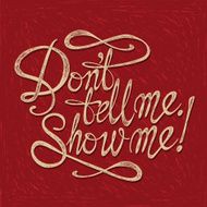 &quot;Don&#039;t Tell Me Show Me&quot; quote on the red background