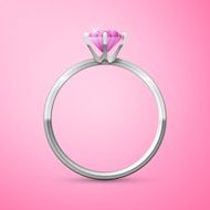 silver wedding ring on pink background