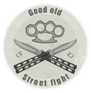 Crossed butterfly knifes with brass knuckle emblem