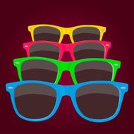 Colorful sunglasses on maroon background