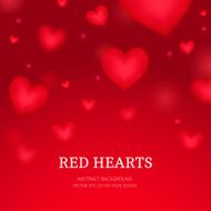 Falling blurred red hearts background