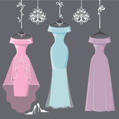 Three long bridesmaid dresses hang on ribbons
