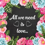 All we need is love with painted flowers on chalkboard