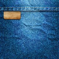 Crumpled denim background with label