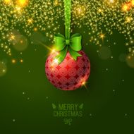 Christmas bauble on green background