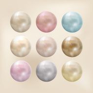 Spherical pearls of different colors