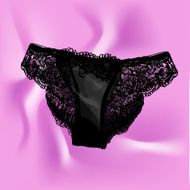 Women&#039;s black lace panties on pink silk Vector illustration