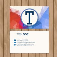 Business card with alphabet letter on a wood background N19