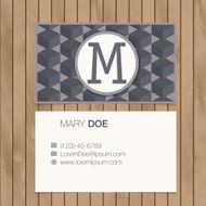 Business card with alphabet letter on a wood background N22