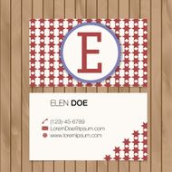 Business card with alphabet letter on a wood background N23