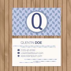 Business card with alphabet letter on a wood background N21