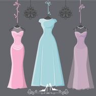 Three retro long bridesmaid dresses hang on ribbons