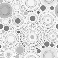 Seamless pattern with gray dots and circles on white background