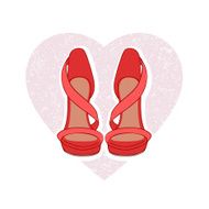 Pair of red sandals on heart back